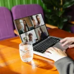 Man on table with laptop